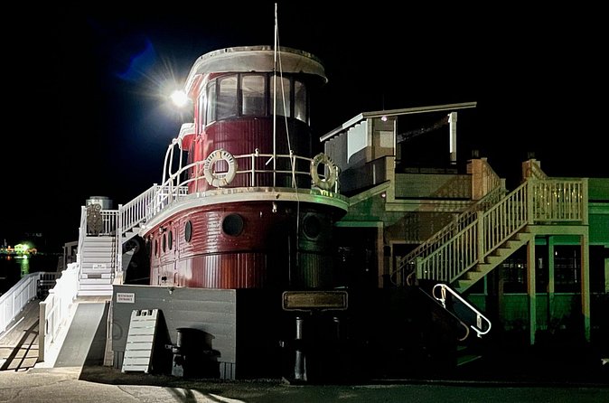 90-Minute Ghost Walking Tour in Boothbay Harbor - The Tugboat Inn and a captain at the wheel