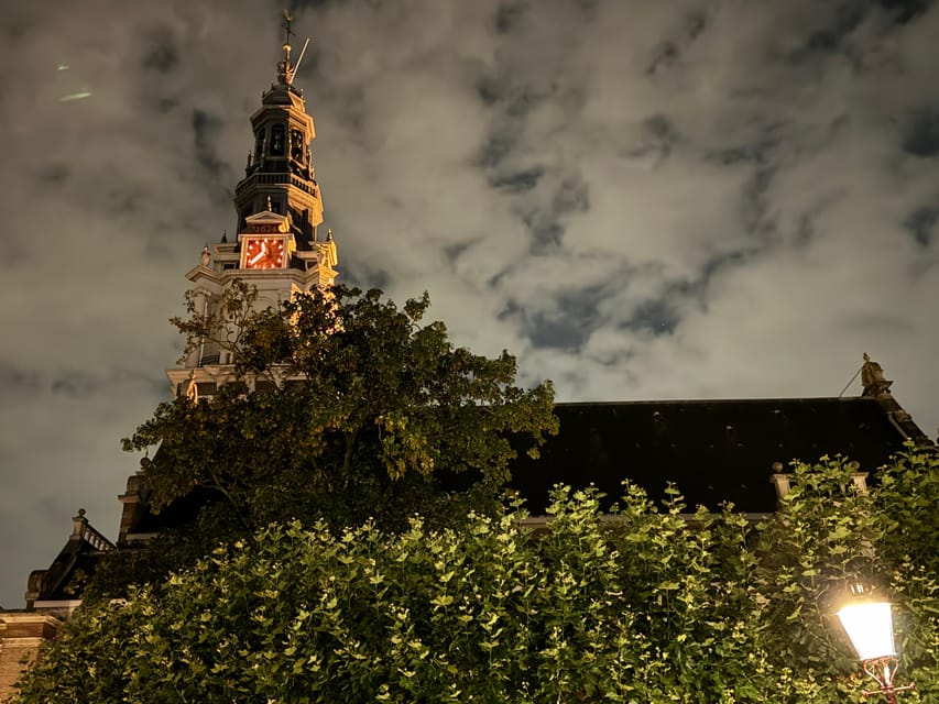 Amsterdam: Ghost Walking Tour and Dark History - Begijnhof, a quiet courtyard with a darker mood