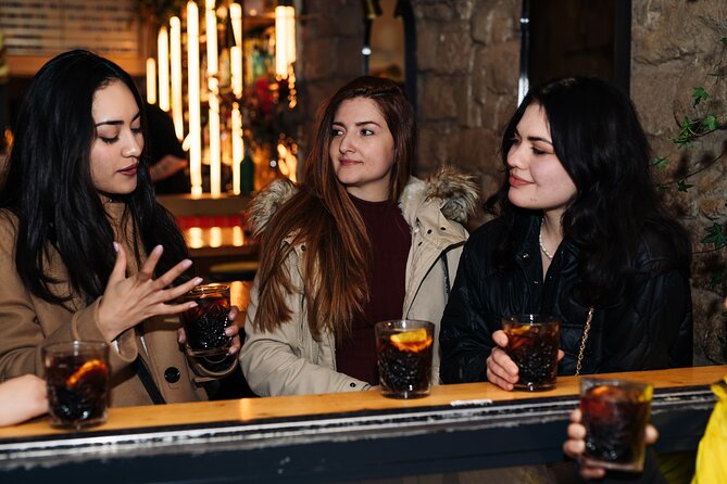 Barcelona Dark History Night Walking Tour With Drinks - The final cocktail and organized bar entry