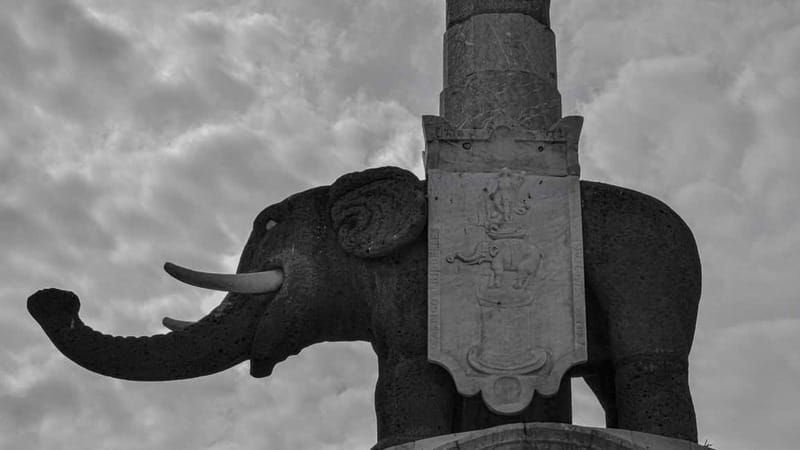 Catania Ghost Tour: Legends and Tastings Under Mount Etna - Piazza Duomo and the magician beneath the lava stone