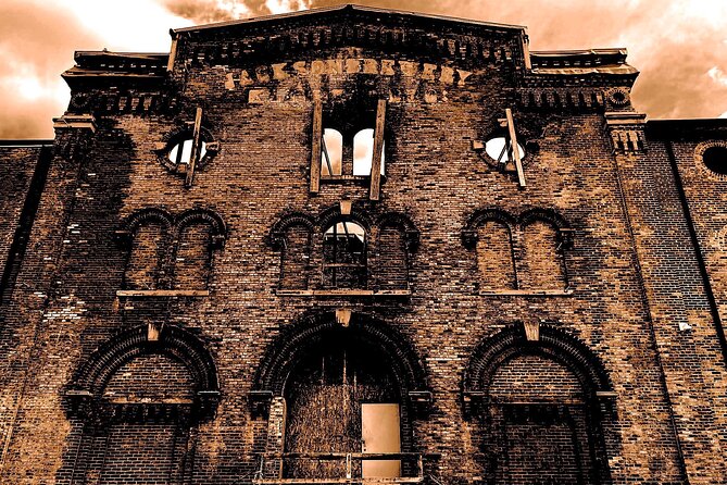 Darkside of Brewing Tour: Tales of Cincinnati's Haunted and Gruesome Past - Inside the Imperial Theater with a flashlight