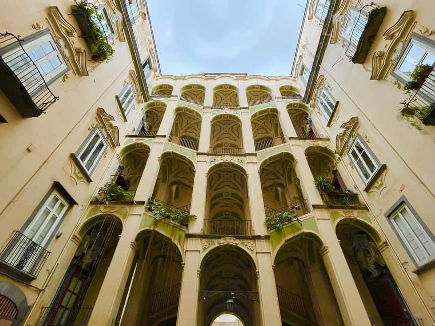 Esoteric Naples: Secrets, Ghosts & Street Food Tour - Palazzo dello Spagnolo’s Baroque drama