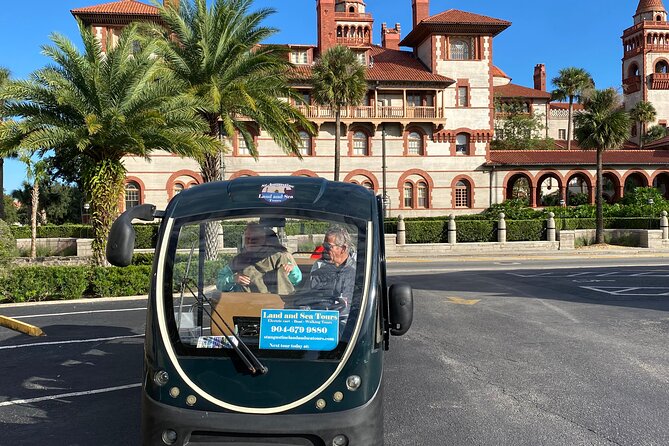 Riding with the Ghosts a Golf Cart Ghost Tour in St Augustine - Riding past former Ponce de Leon and Hotel Alcazar